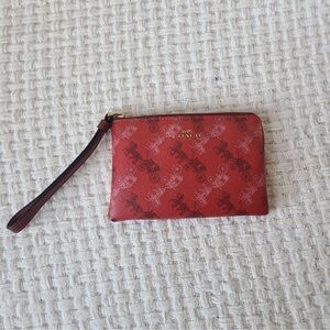 Coach Red Corner Zip Wristlet featuring the brand's iconic Horse and Carriage